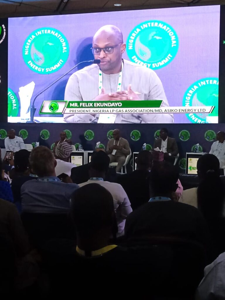 A man speaking on stage at 2023 Nigeria International Energy Summit